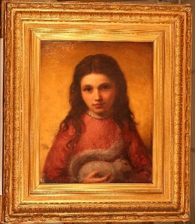 Girl holding a squirrel