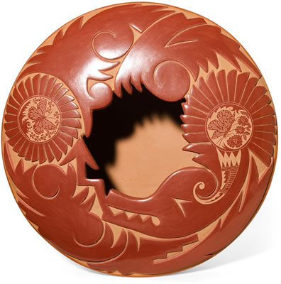 Redware jar carved with an Avanyu serpent