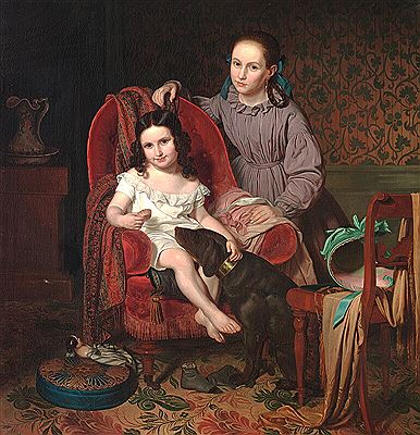 Two sisters giving the dog a treat.