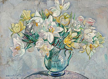Still life with tulips in a glass pitcher.