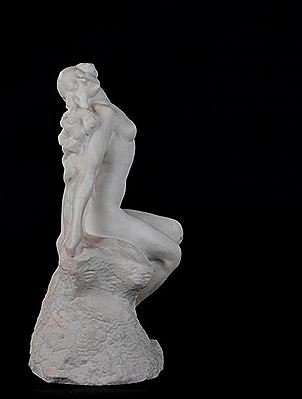 Nude on a rock.