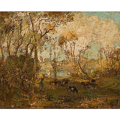 CATTLE GRAZING IN A WOODED LANDSCAPE
