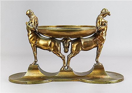 A male and female centaur supporting a bowl