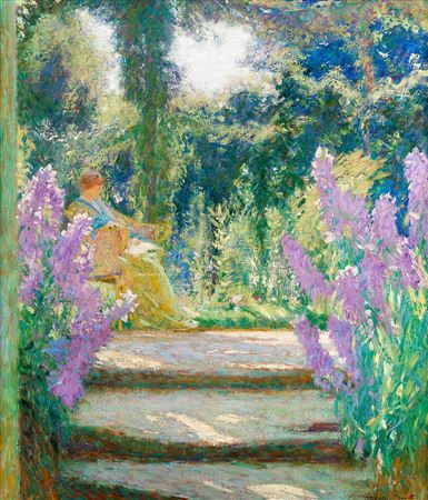Lady seated in a sunlit garden