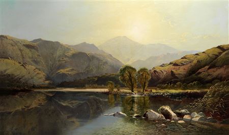Mountains at midday, with cattle resting by a river