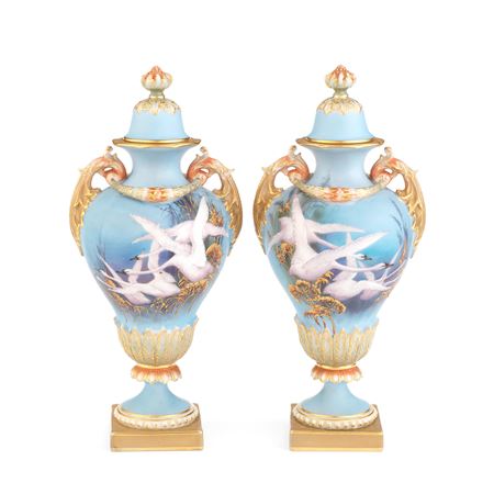 A PAIR OF ROYAL WORCESTER VASES AND COVERS