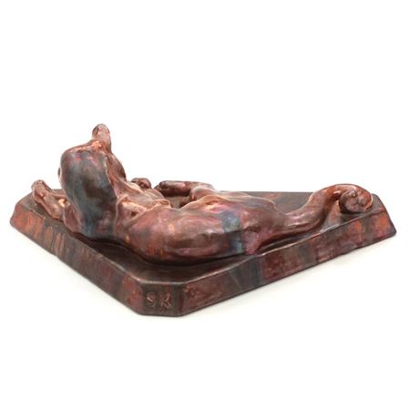 An earthenware figure in shape of a cat