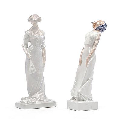 A pair of porcelain figures modelled in the shapes of women.