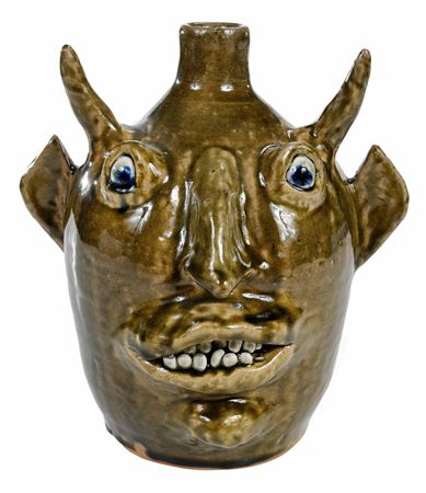Sample artwork by John Meaders (1916 - 1999), known for sculpture-face jugs - View similar artists and auction records