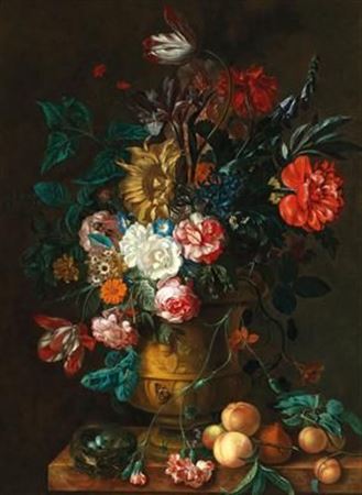 Mixed flowers in a sculpted vase with fruit and a bird’s nest on a ledge