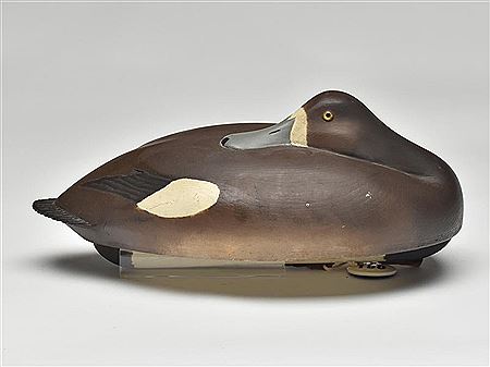 Exceptional hollow carved sleeping bluebill hen