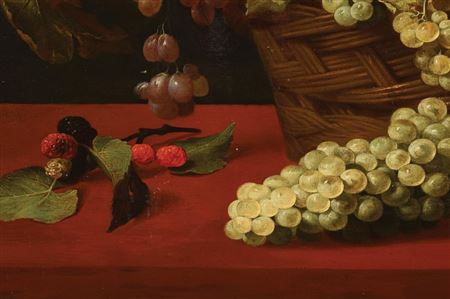 Still life with a basket of grapes with a loaf of bread and lemon