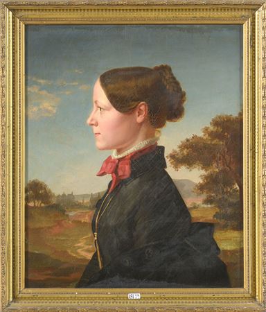 "Portrait of a woman in profile on a landscape background"