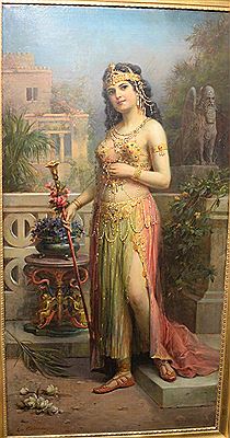 Full length woman portrait, wearing jeweled dress in courtyard