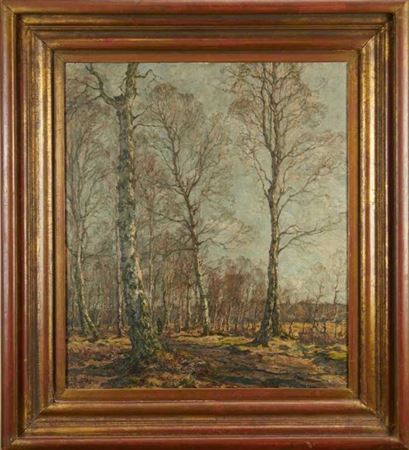 Winter woodland with a figure on a track