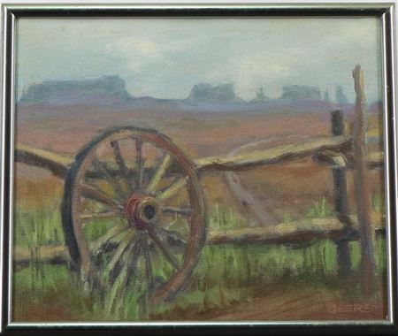Southswestern landscape with an old wagoon wheel