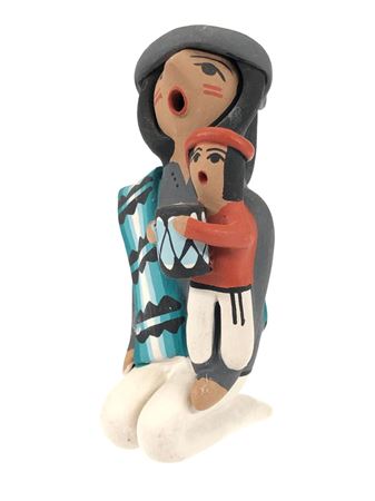 JEMEZ KNEELING MALE STORYTELLER