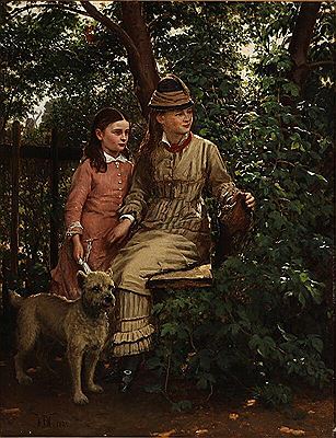 Two sisters on a bench in a forest glade