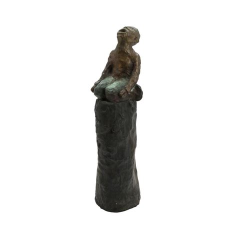 Seated figure.