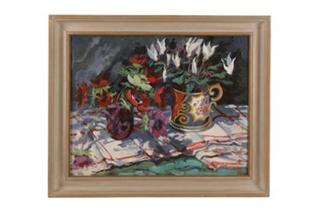 Still life of flowers in jugs on a tablecloth