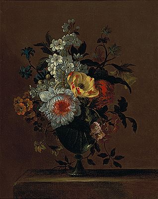 Flowers in a glass vase on a pedestal