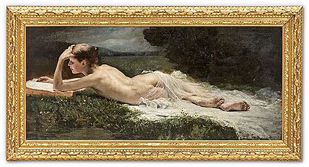 Lying nude on a spring meadow reading in a large book