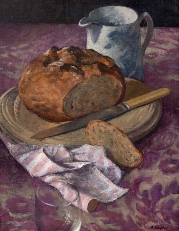 Still life - a cut loaf of bread and further utensils on a patterned table surface