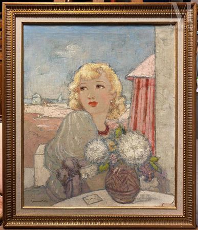 Young woman with a bouquet of flowers on a beach
