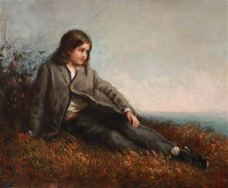 Young boy looking at the sea