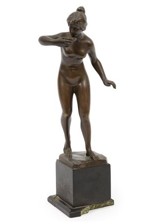 Figure drinking from a cup