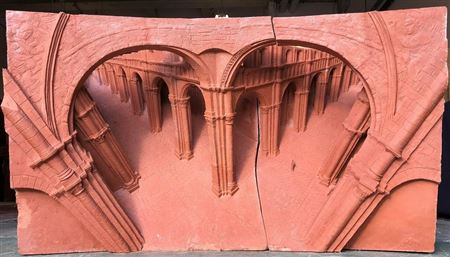 A high relief terracotta sculpture of figures in a nave
