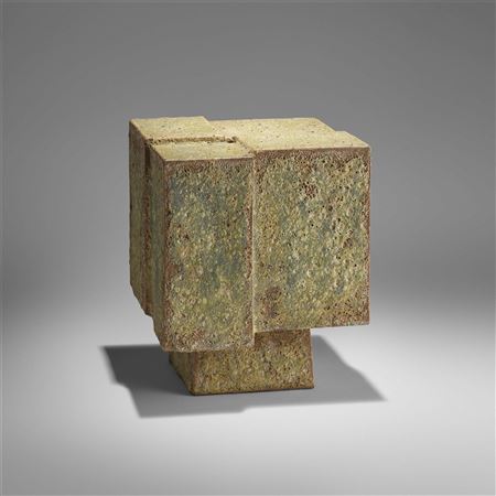 Large fragmented cube on tall pyramidal base