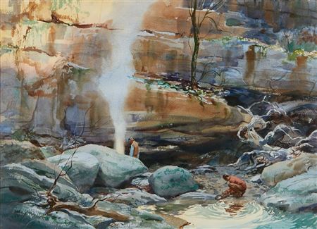 A miner panning for gold in a rocky stream