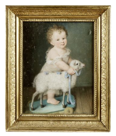Infant with a lamb as a draught animal