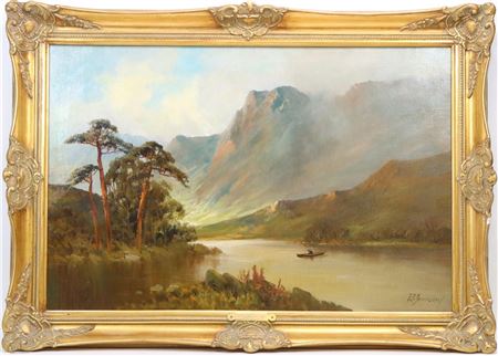 Valley landscape with a fisherman at the base of towering mountains