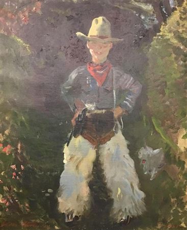 Portrait of a young boy dressed as a cowboy