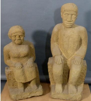 PAIR OF MONUMENTAL CARVED STONE FIGURE