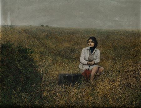 Woman with suitcase and umbrella in a field