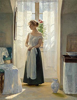 Morning toilette. Interior with a young woman standing in front of a mirror by the window, with sunlight streaming into the room through the light curtains. Her light summer dress is placed on a chair.