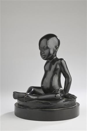 Seated young African child