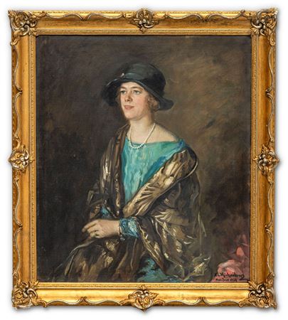 Elegant lady with pearl necklace in turquoise green dress and wide coat, half-length portrait.
