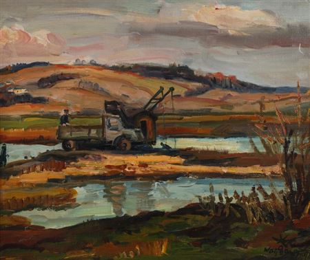 Surface mining works at the edge of a lake