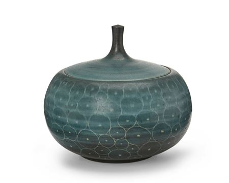 A glazed stoneware lidded jar