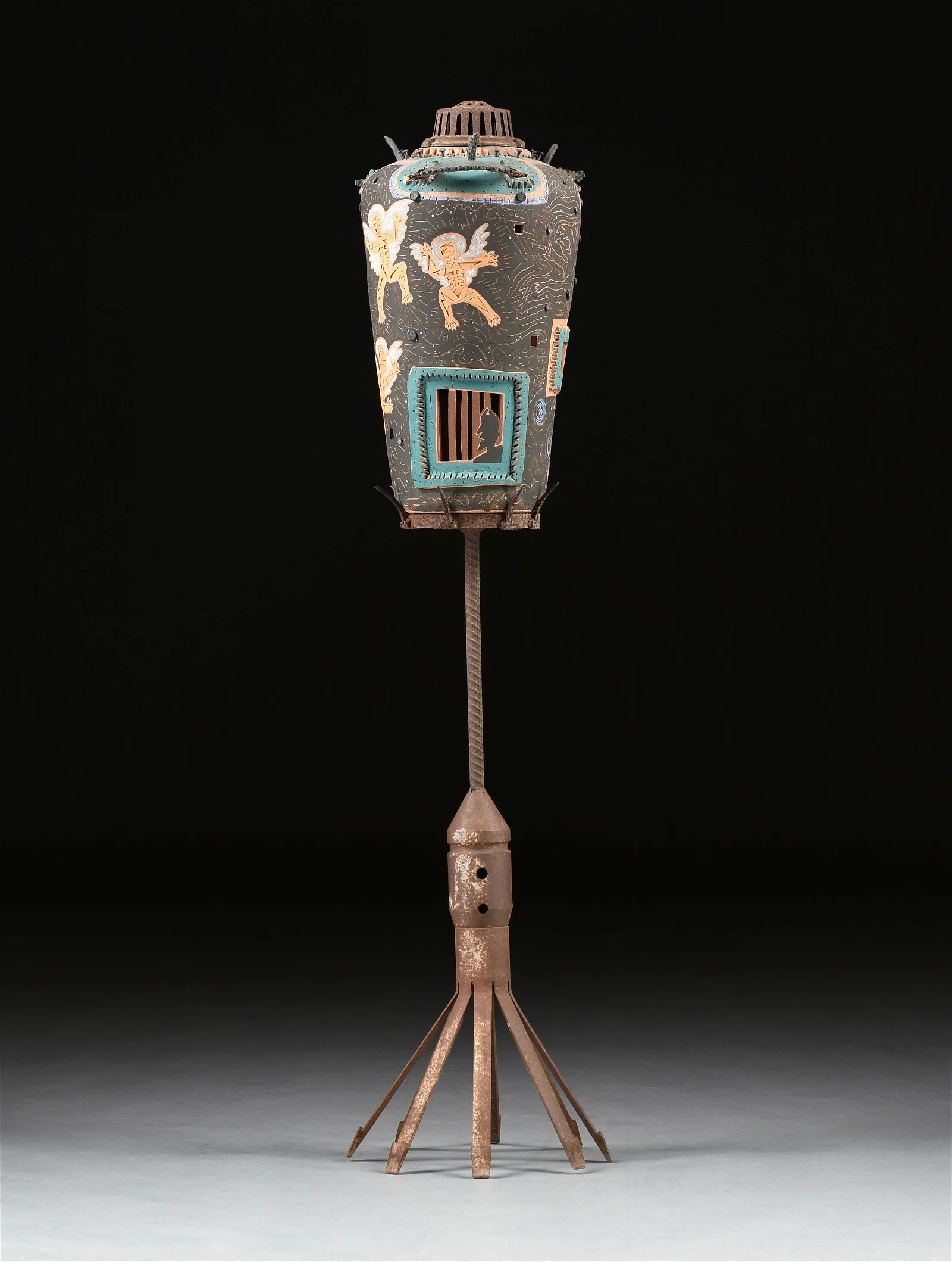 A CERAMIC SCULPTURE ON STAND