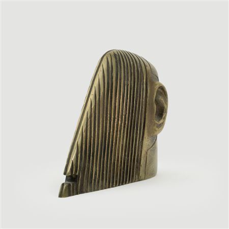 A SMALL TATOOED HEAD.