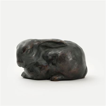 A Sitting hare with adjacent spoons.