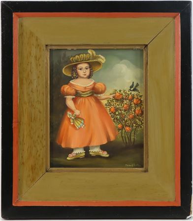 Portrait of a young girl holding her doll