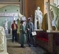 A young student fresh from high school shows a young girl the antique collection at the National Gallery of Denmark.