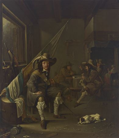 An Ensign seated in a guardroom, with officers playing at cards and a woman smoking by a chimney