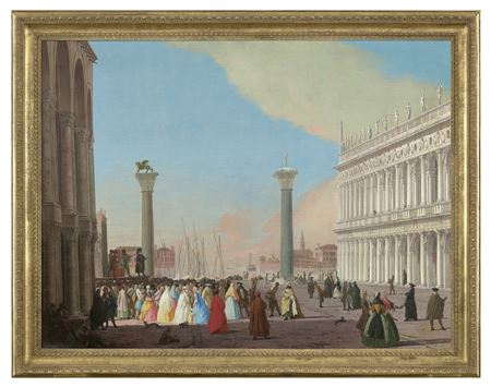 Venice, the Piazzetta looking south from the Basilica di San Marco with the Biblioteca and a crowd gathered to watch a Commedia dell'arte performance